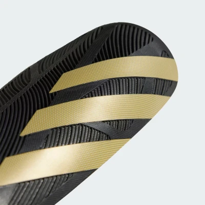 Adidas TIRO SG COM BLACK/GOLDMT/WHITE fotbalové chrániče