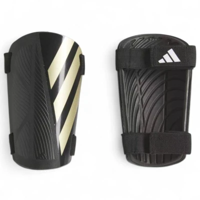 Adidas TIRO SG TRN BLACK/GOLDMT/WHITE fotbalové chrániče