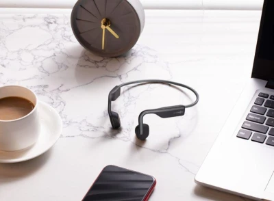 AfterShokz OpenMove šedá bezdrátová sluchátka s kostním přenosem zvuku
