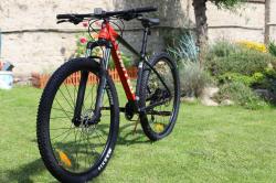 United Clovis 3.10 29 šedo/červené horské kolo + výbava zdarma